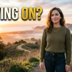 Woman standing outdoors at sunrise moving on after a breakup